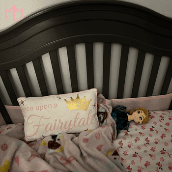 crib with blanket and loveys
