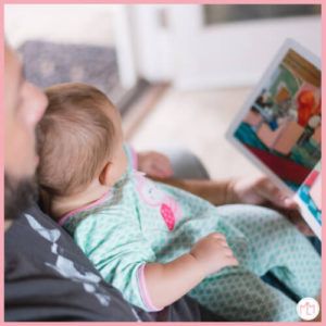 Dad and baby reading